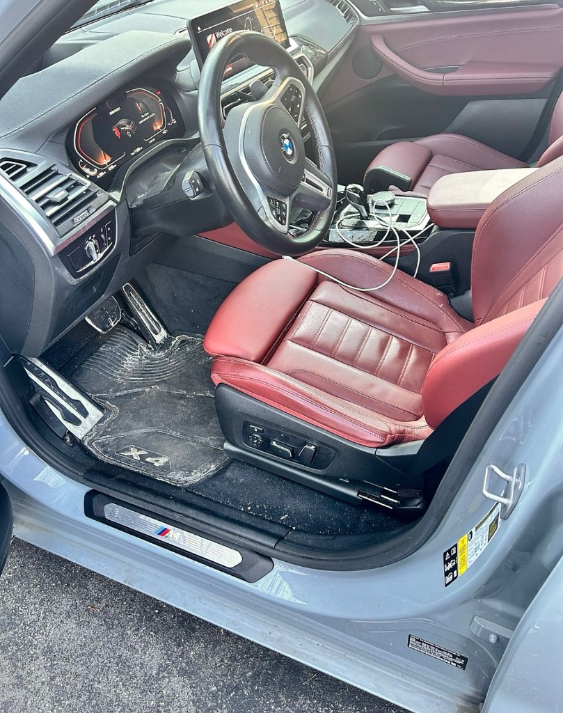 Luxury red leather interior before deep cleaning and UV restoration in Kaysville UT