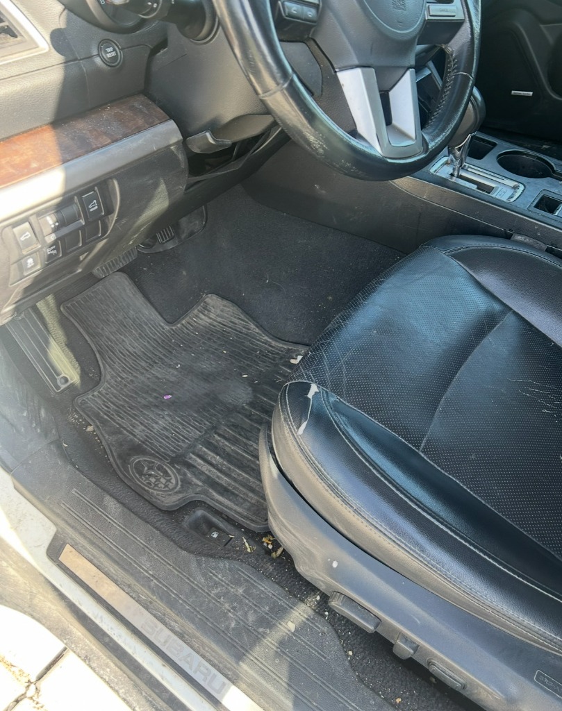 Dirty Subaru all-weather floor mat with salt before car carpet shampooing in Brigham City Utah