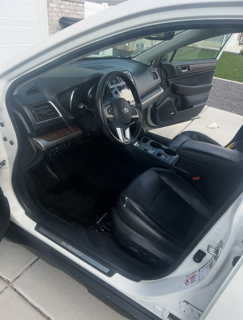 Immaculate Subaru interior with restored black floor mats covering Northern Utah area